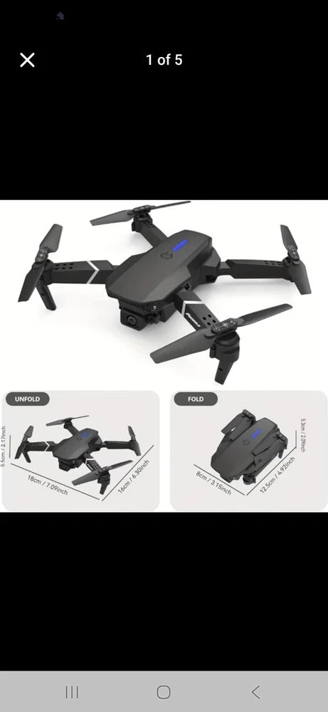 Foldable mini quadcopter drone with four propellers, dark gray body
