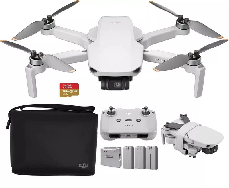 White quadcopter drone with camera, controller, extra batteries, and carrying case