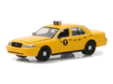 1:64 scale yellow taxi model car with black grille and side logos