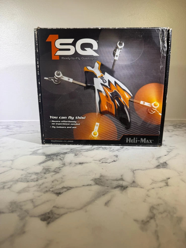 Heli-Max 1SQ RTF quadcopter drone box, black and orange graphics with TSQ label