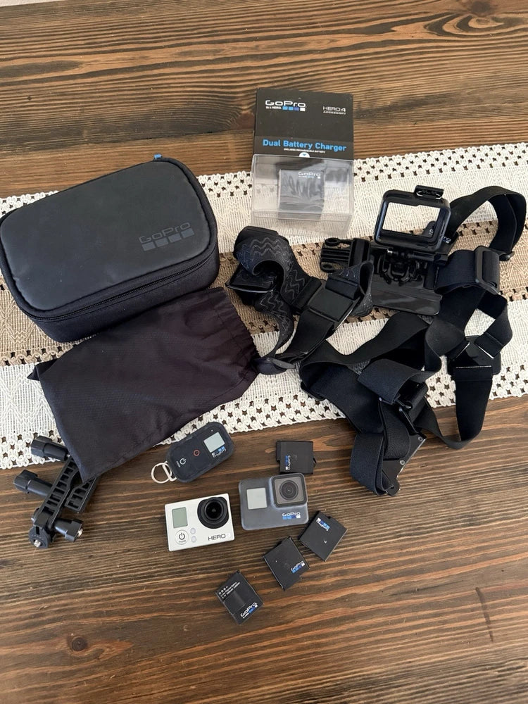 Action camera bundle with two GoPro cameras, dual charger, batteries, chest and head mounts
