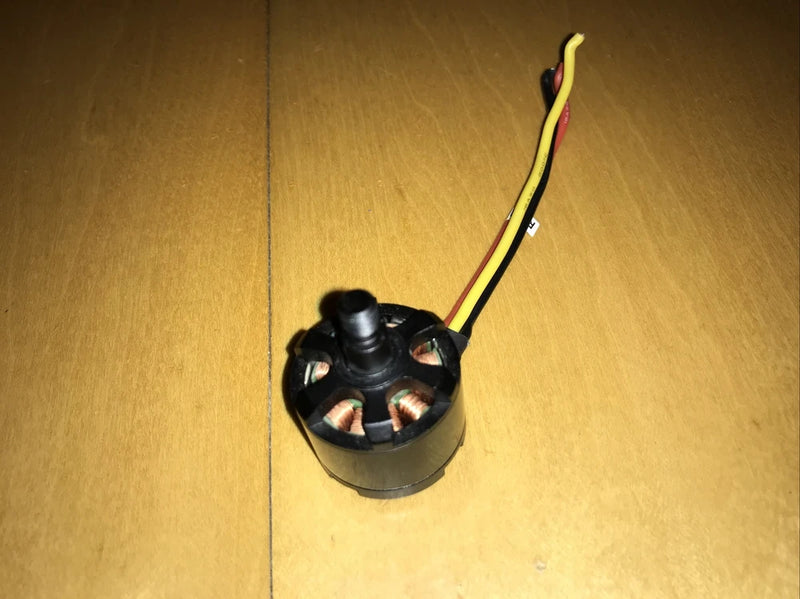 Black quadcopter replacement motor with red and yellow wire leads