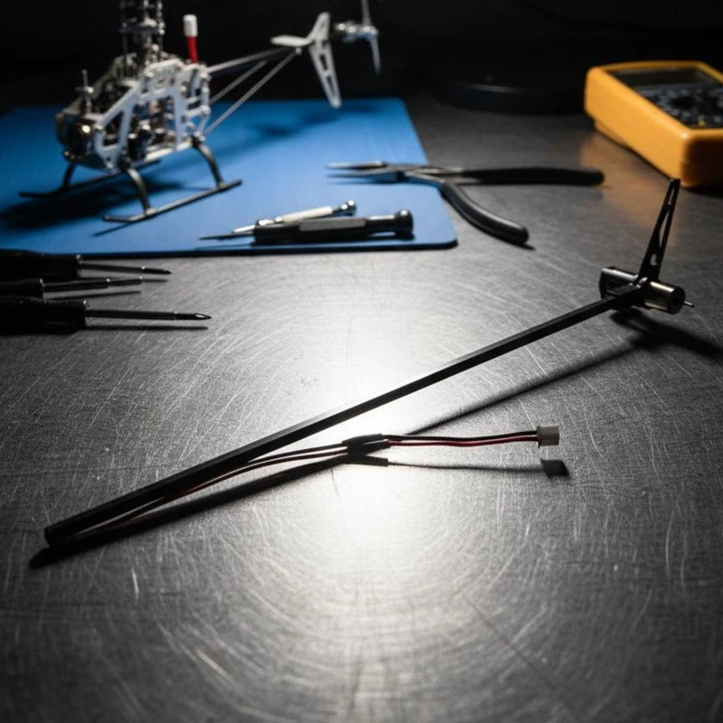 RC helicopter tail boom assembly with bundled wires and connector ends