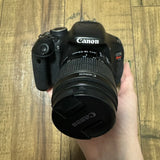 Canon EOS Rebel T3i black DSLR camera with attached 18-55mm lens