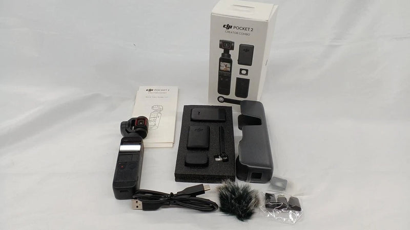 DIJ POCKET2 action camera kit with case, strap, mount, charger, and microphone