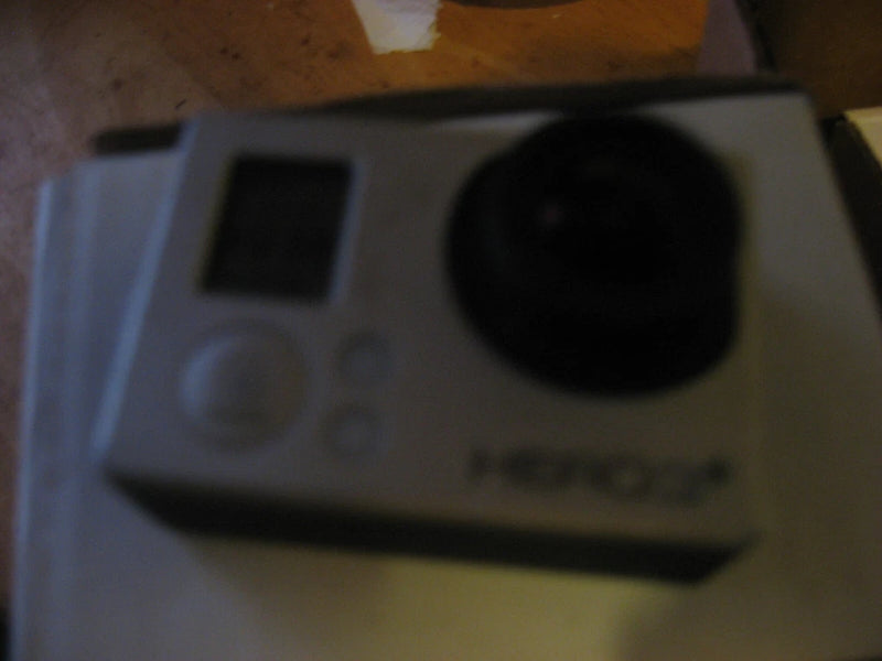GoPro HERO3+ action camera with large lens and side buttons, silver body.