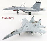 Gray fighter jet model with landing gear and twin tail, angled top view.