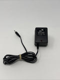 ADI battery charger adapter with LED indicator and attached power cable, black