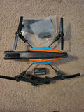 Parrot AR.Drone 2.0 quadcopter with orange and blue body and four propeller arms