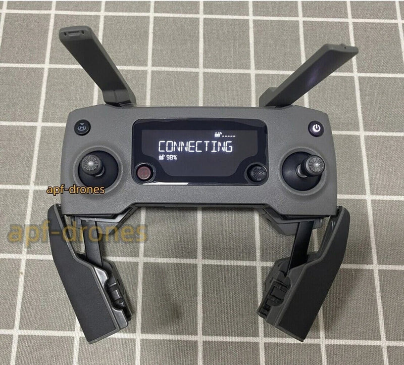 Gray drone remote controller with dual joysticks and LCD screen