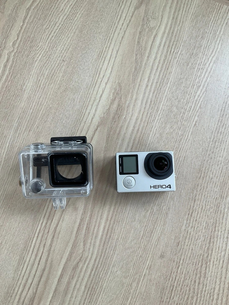 GoPro HERO4 action camera with clear waterproof case and exposed lens