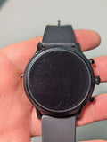 Men's Fossil watch with black dial and dark strap, front view.