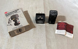 GE rechargeable battery charger kit with AA module, base, and instruction cards