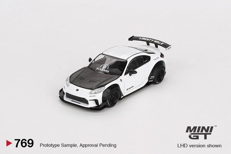 White die-cast model sports car with black wheels and rear wing