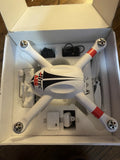 White quadcopter drone with orange-red accents and four propellers
