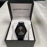 Geoffrey Beene black diamond collection wristwatch with black round dial and band