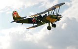 Green and black RC biplane with red star markings and fixed landing gear