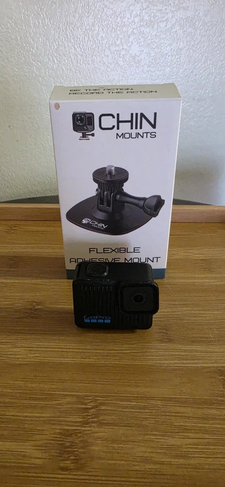 Universal chin mount with flexible arm for action camera, shown with black camera