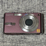 Panasonic LUMIX pink compact digital camera with lens and Leica logo