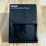 Kodak Li-ion rapid battery charger with open battery bay and port
