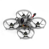 Tiny FPV quadcopter drone with four clear prop guards, gray frame, front camera lens