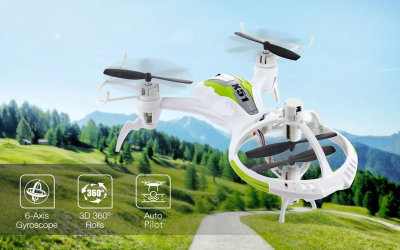 White RC UFO-style drone with green accents, four propellers