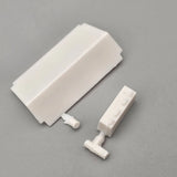 Model car rear battery tray and battery detail parts, off-white plastic pieces