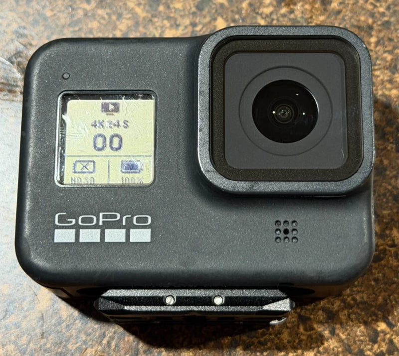 Black GoPro HERO8 action camera with front lens and status screen in rugged case