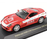 Red and white die-cast race car model with open windshield on display base