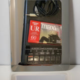 Black cassette recorder with front control buttons and cassette deck
