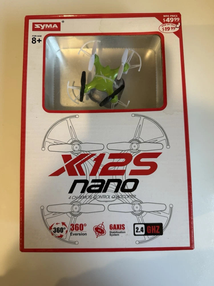 Nano quadcopter drone in retail box with green propellers