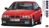 Red 1/24 scale model car kit of BMW 3 Series E36 320i 4-door sedan (front view)