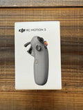 DJI RC Motion 3 gray handheld controller on retail box