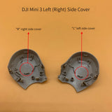 Gray plastic drone side cover shell pair with mounting tabs and slots