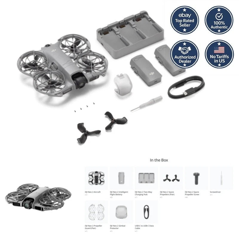 Gray quadcopter drone with propellers, battery pack, charging dock, cable and accessories