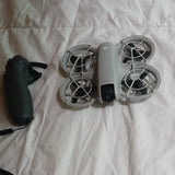 DJI Neo ready-to-fly drone with gray prop guards and black motion controller