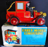 Red tin toy limousine with driver figure, battery powered, with original box