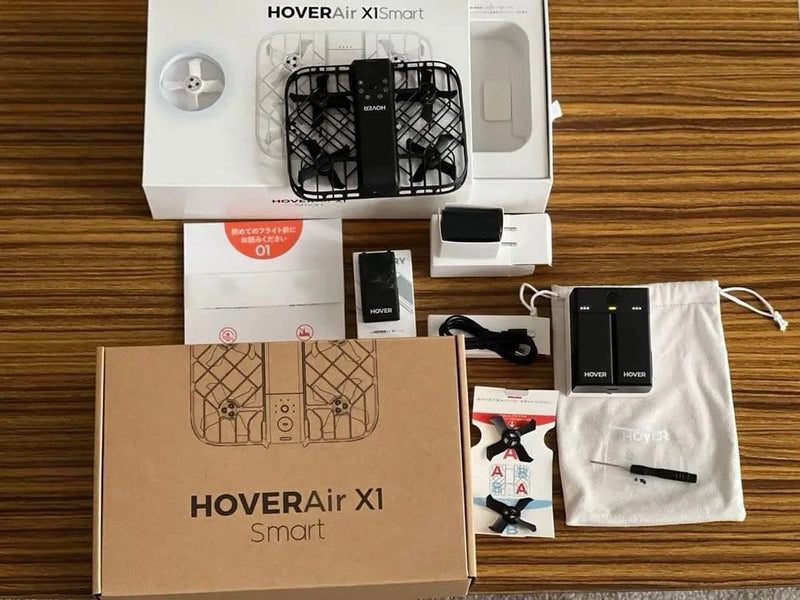 Smart drone kit box with drone, controller, cable, and storage pouch