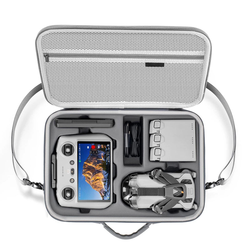 Gray drone carrying case with foam insert, opened showing drone, controller, cables