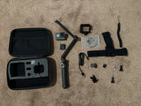 GoPro HERO5 action camera bundle with black case, mounts, strap, and batteries