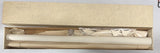Vintage RC airplane kit wing spars and parts in open cardboard box