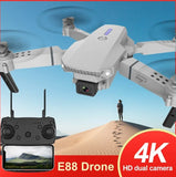 Folding quadcopter drone with front camera, controller with screen and HD dual camera view