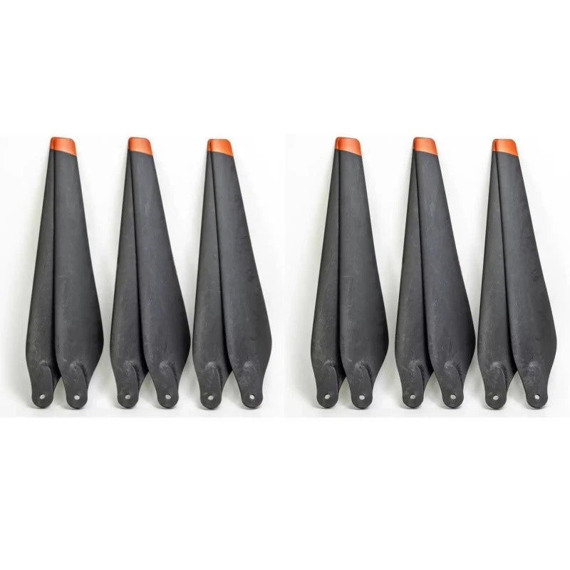 Agricultural drone propeller set with black blades and orange tip guards