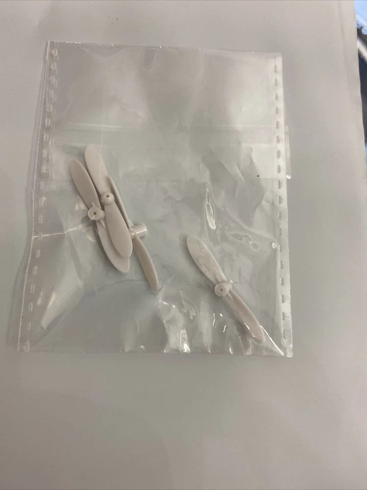 Mini RC drone replacement rotor blades, two light gray propellers in sealed bag