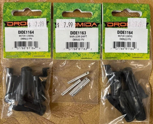 Black FPV motor cover and main gear shaft parts, in blister package with two bags