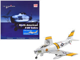 1/72 North American F-86E Sabre fighter aircraft model with yellow tail stripes