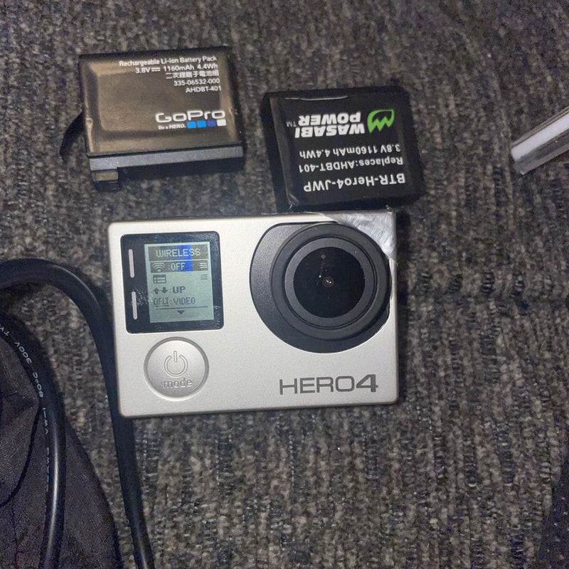 Silver GoPro HERO4 action camera with front LCD screen and wide lens