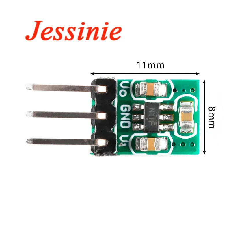 Green DC-DC converter module PCB with three-pin header and voltage regulator components