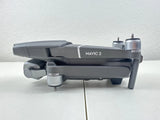 Gray quadcopter drone with front gimbal camera and extended arms