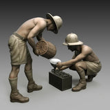 Unpainted 1/35 resin soldier model kit with two helmeted figures and battery box
